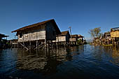 Inle Lake Myanmar. All the buildings are constructed on piles. Residents travel around by canoe, but there are also bamboo walkways and bridges over the canals, monasteries and stupas. 